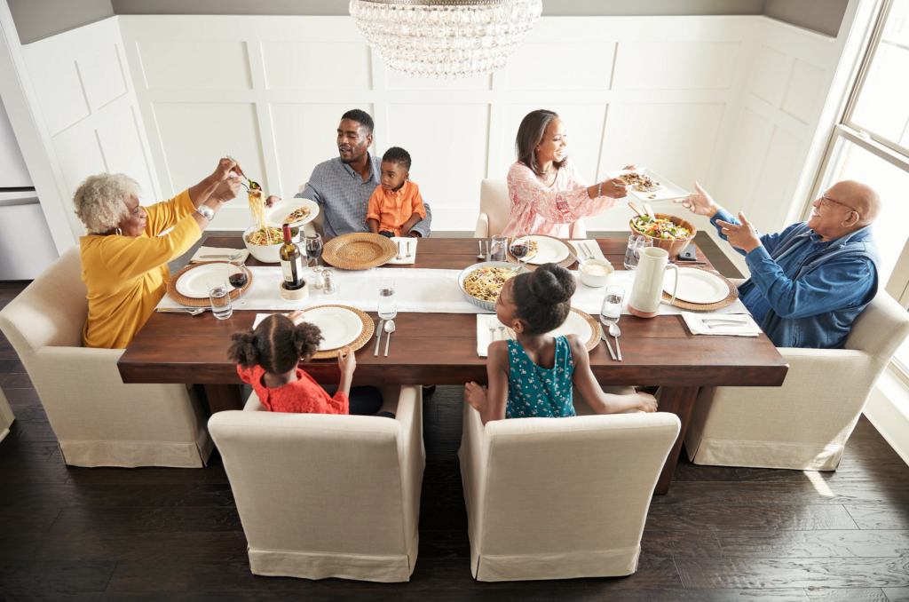 Happy family enjoying breakfast | Broadway Carpets, Inc