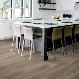 Mohawk Laminate in a gray-brown wood tone in a modern kitchen | Broadway Carpet & Flooring