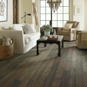 CornerstoneOak-SW676-07044-Granite-5in-RM Dark gray hardwood in a living room | Broadway Carpet & Flooring