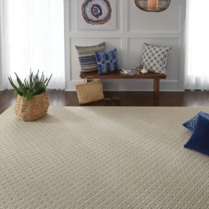 A Shaw Floors area rug in a light sand color | Broadway Carpet & Flooring