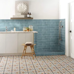 Noble-306TS-00450-Mint-3x12-RM-V Mint blue subway tile on the wall and multi-colored patterned tile on the floor | Broadway Carpet & Flooring