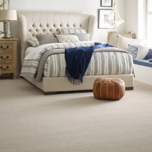 Cream colored Shaw Floors carpet in a contemporary bedroom | Broadway Carpet & Flooring